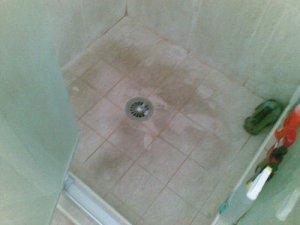 Shower before cleaning, floor of shower stall